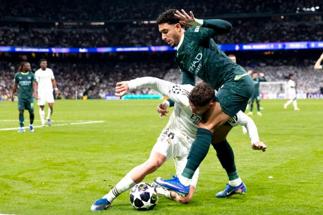 UEFA champions league - Real Madrid vs Manchester City MADRID, SPAIN - March 11:Federico Valverde of Real Madrid and Omar Marmoush of Manchester City in action during the UEFA champions league 2025 26 round of 16 first leg match between Real Madrid and Manchester City at Santiago Bernabeu Stadium. (Photo by Guille Martinez f22photo) Madrid Santiago Bernabeu Stadium Spain Copyright: xGuillermoxMartinezx