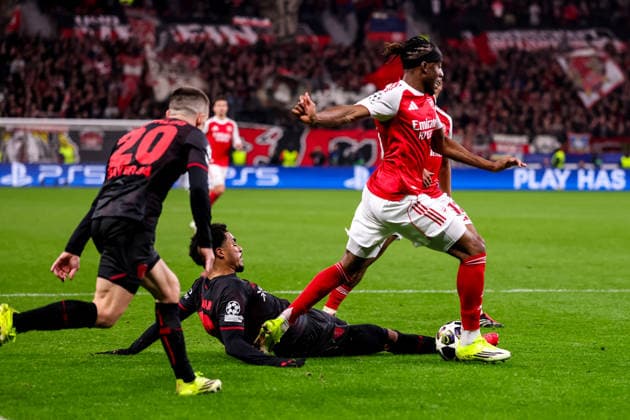 LEVERKUSEN, GERMANY - MARCH 11: Noni Madueke of Arsenal is fouled by Malik Tillman of Bayer 04 Leverkusen during the UEFA Champions League 2025 26 Round of 16 First Leg match between Bayer 04 Leverkusen and Arsenal FC at BayArena on March 11, 2026 in Leverkusen, Germany.  Copyright: xRenexNijhuis MBxMediax