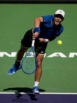 March 11, 2026 Rinky Hijikata (AUS) serves against Cameron Norrie (GBR) during their fourth round match at the BNP Paribas Open held at the Indian Wells Tennis Garden in Indian Wells, California. California. Mandatory Photo Credit : CSM Indian Wells United States of America - ZUMAc04_ 20260311_zma_c04_100 Copyright: xCharlesxBausx