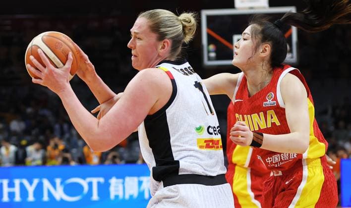 Belgium s Emma Meesseman and China Yuery Li fight for the ball during a basket game between China and Belgium s national team, Nationalteam Belgian Cats, in Wuhan, China, on Thursday 12 March 2026, the second game (out of 5) of the qualifications phase for the World Cup Basket tournament. NIKOLAxKRSTIC  x167247712x