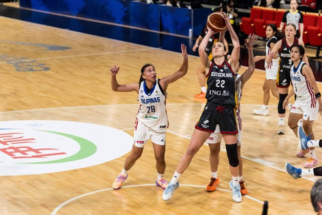 LYON-VILLEURBANNE, FRANCE - MARCH 12: Emily Bessoir (Germany, 22) controls the ball against Kacey Dela Rosa (Philippines, 28) during the FIBA Women™s World Cup Qualifying Tournament match between Philippines (PHI) vs. Germany (GER) at Astroballe on matchday 2 of the FIBA Women™s World Cup Qualifying Tournament on March 12, 2026 in Lyon-Villeurbanne, France. France Copyright: xSteffiexWunderlx