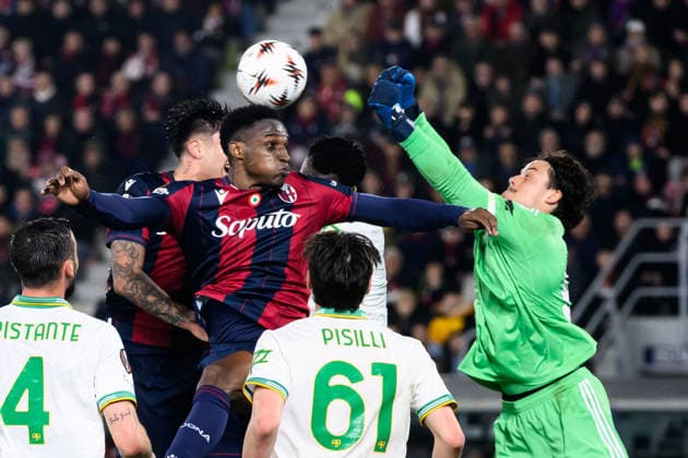 Mile Svilar of AS Roma saves on Jhon Lucumi of Bologna FC during the UEFA Europa League 2025 2026 football match between Bologna FC 1909 and AS Roma at Renato Dall Ara Stadium in Bologna (Italy), March 12, 2026. andreaxstaccioli