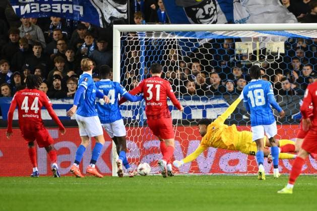 KRC Genk v Freiburg - UEFA Europa League GENK, BELGIUM - MARCH 12 : Johan Manzambi midfielder of Freiburg scores a goal, Lawal Tobias goalkeeper of KRC Genk during the UEFA Europa League 2025 26 round of 16 match first leg between KRC Genk and Freiburg on March 12, 2026 in Genk, Belgium, 12 03 2026 Genk Belgium  Copyright: xVincentxKalutx