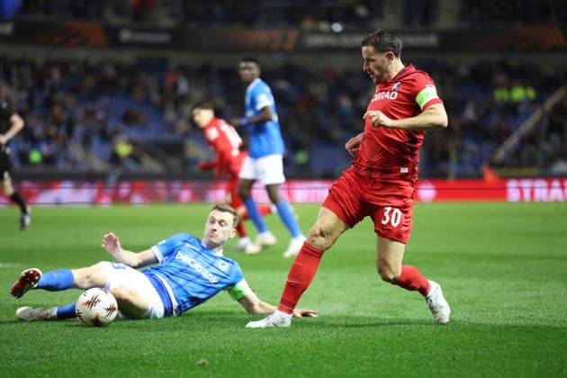 12.03.2026, xrekx, Fussball UEFA Europa League, KRC Genk - SC Freiburg v.l. Bryan Heynen (KRC Genk) Christian Günter Guenter (SC Freiburg) Zweikampf, Aktion, action, battle for the ball (DFL DFB REGULATIONS PROHIBIT ANY USE OF PHOTOGRAPHS as IMAGE SEQUENCES and or QUASI-VIDEO) Genk