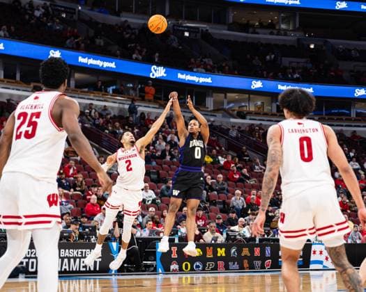 Basketball, NCAA, Wisconsin Badgers - Washington Huskies March 12, 2026, Chicago, Illinois, USA: Washington basketball player QUIMARI PETERSON shoots a three-pointer in the third round game against Wisconsin during the 2026 TIAA Big Ten Men s Basketball Tournament at the United Center. 2026 TIAA Big Ten Men s Basketball Tournament: Wisconsin 85: Washington: 82  - ZUMAw173 20260312_zsp_w173_001 Copyright: xLukexWelshx