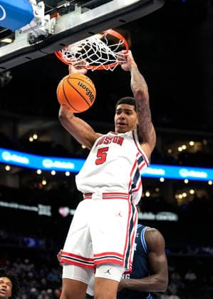 MAR 12 2026: Houston Cougars center Chris Cenac Jr. (5) slam dunks the opening 2 points against BYU in the Big 12 Championship Tournament at T-Mobile center, Kansas City, Missouri. CSM. Kansas City United States - ZUMAc04_ 20260312_zma_c04_229 Copyright: xJonxRobichaudx