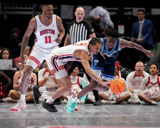 MAR 12 2026: Houston Cougars guard Milos Uzan (7) pokes the ball away from BYU Cougars forward AJ Dybantsa (3) in the Big 12 Championship Tournament at T-Mobile center, Kansas City, Missouri. CSM. NCAA, College League, USA Basketball 2026: BYU Vs Houston Big 12 Tournament  - ZUMAc04_ 20260312_zma_c04_228 Copyright: xJonxRobichaudx