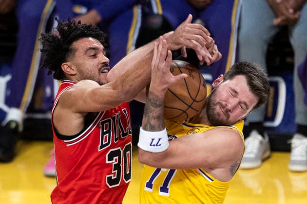 March 12, 2026, Los Angeles, California, USA: Los Angeles LakersÃ¢â‚¬â ¢ Luka DonÄÂiÄ¡ (77) and Chicago BullsÃ¢â‚¬â ¢ Tre Jones (30) vie for the ball during an NBA, Basketball Herren, USA basketball game at Crypto.com Arena on Thursday, March 12, 2026 in Los Angeles. Los Angeles USA - ZUMAc68_ 20260312_zaf_c68_003 Copyright: xRingoxChiux
