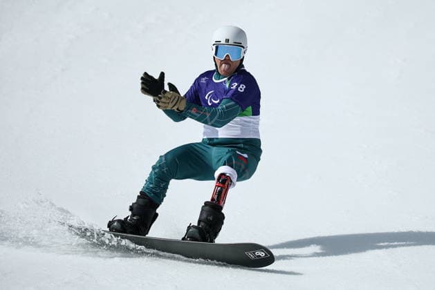 ITALY, CORTINA D AMPEZZO - MARCH 13, 2026: Dmitry Fadeyev of Russia competes in the men s banked slalom SB-LL1 final during the 2026 Winter Paralympic Games at the Tofane Alpine Skiing Centre. Mikhail Tereshchenko TASS  89964369