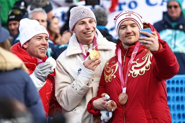 ITALY, VENETO - MARCH 13, 2026: Silver medallist Robin Cuche of Switzerland, gold medal winner Arthur Bauchet of France and bronze medallist Aleksei Bugaev of Russia (L-R) during the victory ceremony for the men s para alpine skiing giant slalom standing event at Tofane Alpine Skiing Centre during the 2026 Winter Paralympic Games, in Cortina d Ampezzo, Province of Belluno 2026 Winter Paralympics: Para Alpine Skiing  - ZUMAt113 20260313_zaa_t113_285 Copyright: xMikhailxTereshchenkox