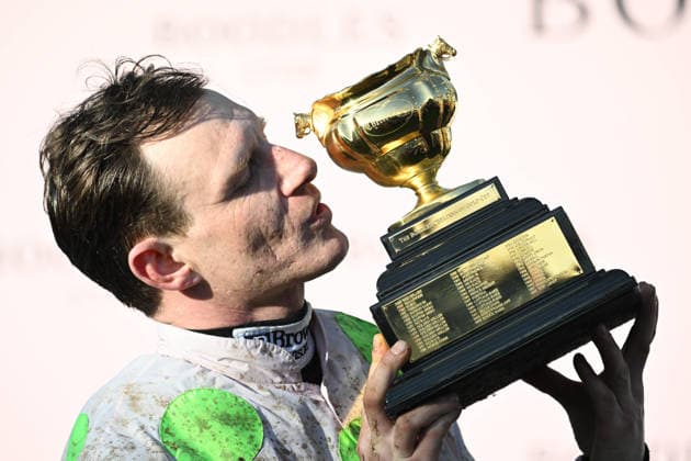 13th March 2026; Cheltenham Racecourse, Cheltenham, Gloucestershire, England; Cheltenham Festival Horse Racing; Day Four; Paul Townend kisses the Gold Cup after winning the Boodles Cheltenham Gold Cup Chase (Grade 1) race  SimonxWest Content restricted for UK based newspaper