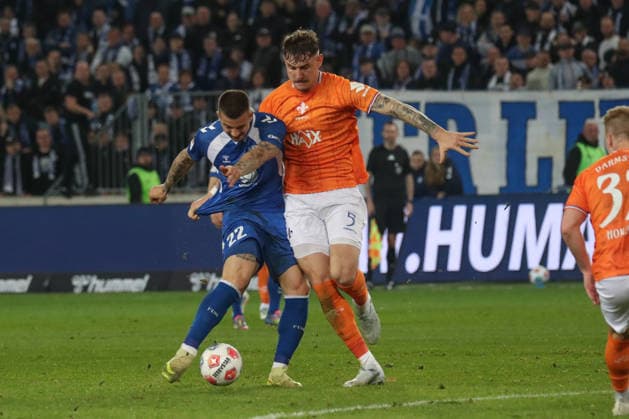 13.03.2026, xgox, Fussball 2. Bundesliga, 1. FC Magdeburg - SV Darsmtadt 98 emspor, v.l. Mateusz Zukowski (Magdeburg, 22), Matej Maglica (Darmstadt, 5) Zweikampf, Duell, Kampf, tackle (DFL DFB REGULATIONS PROHIBIT ANY USE OF PHOTOGRAPHS as IMAGE SEQUENCES and or QUASI-VIDEO) Magdeburg