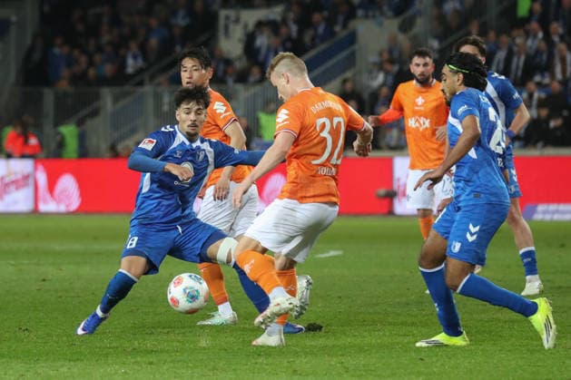 13.03.2026, xgox, Fussball 2. Bundesliga, 1. FC Magdeburg - SV Darsmtadt 98 emspor, v.l. Laurin Ulrich (Magdeburg, 8), Fabian Holland (Darmstadt, 32) (DFL DFB REGULATIONS PROHIBIT ANY USE OF PHOTOGRAPHS as IMAGE SEQUENCES and or QUASI-VIDEO) Magdeburg
