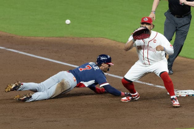 Bobby Witt Jr. (L) of the United States slides past Josh Naylor of Canada during a World Baseball Classic game between the United States and Canada at Daikin Park in Houston, Texas, United States, 13 March 2026. World Baseball Classic: United States - Canada !ACHTUNG: NUR REDAKTIONELLE NUTZUNG!  Copyright: xCarlosxRamirezx AME3854 20260314-55019692328_1