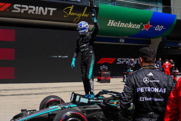CHINA-MOTORSPORTS F1-SHANGHAI Mercedes™ George Russell standing on his F1 car after winning the Sprint in the pits at Shanghai International Circuit during the F1 Chinese Grand Prix, Shanghai, China, March 14, 2026. NEXPHER Peter Li SHANGHAI