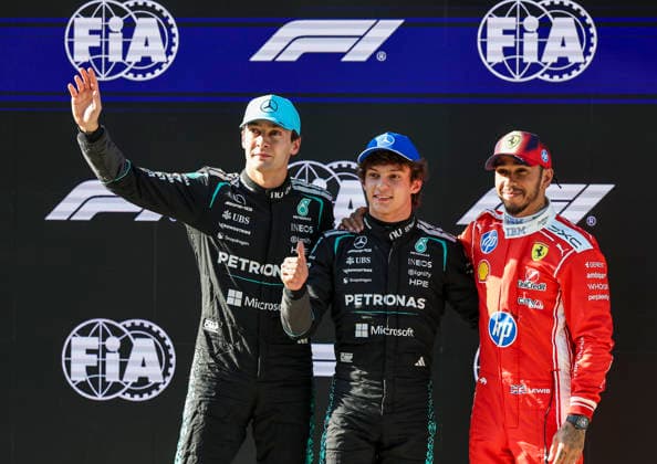 March 14, 2026, Shanghai, Shanghai, China: Scuderia Ferrari driver LEWIS HAMILTON places an arm around Mercedes-AMG Petronas Formula One Team driver ANDREA KIMI ANTONELLI during a group photo after interviews following qualifying for the Formula One Chinese Grand Prix at Shanghai International Circuit, appearing happy for the young pole sitter. Shanghai China - ZUMAh201 20260314_zsp_h201_040 Copyright: xYichinxHoux