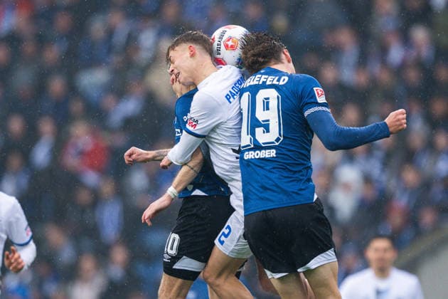 14.03.2026 - Fußball, 2025 2026, 2. Bundesliga, 26. Spieltag, DSC Arminia Bielefeld - SC Paderborn 07: (L-R) Marvin Mehlem (Bielefeld), Ruben Müller (Paderborn), Maximilian Großer (Bielefeld) DFL REGULATIONS PROHIBIT ANY USE OF PHOTOGRAPHS AS IMAGE SEQUENCES AND OR QUASI-VIDEO.