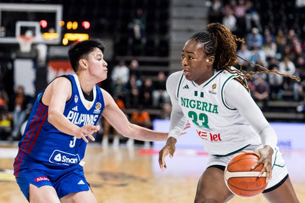 LYON-VILLEURBANNE, FRANCE - MARCH 14: Nicole Enabosi (Nigeria, 33) controls the ball against Afril Bernardino (Philippines, 3) during the FIBA Women™s World Cup Qualifying Tournament match between Nigeria (NGR) vs. Philippines (PHI) at Astroballe on matchday 3 of the FIBA Women™s World Cup Qualifying Tournament on March 14, 2026 in Lyon-Villeurbanne, France. France Copyright: xSteffiexWunderlx