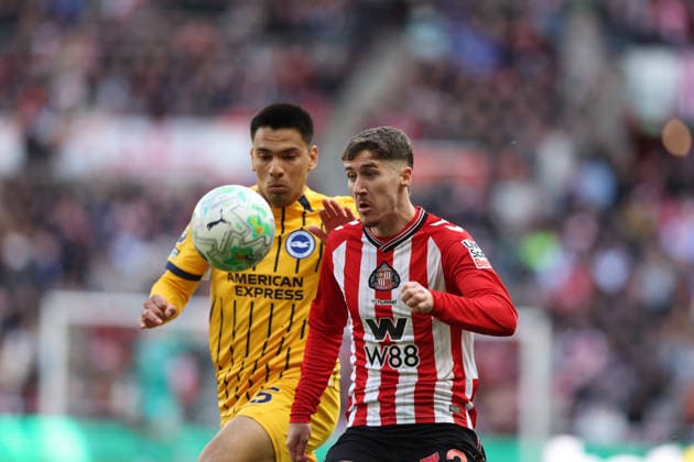 Sunderland, England, 14th March 2026. Trai Hume (R) of Sunderland in action with Diego Gomez of Brighton and Hove Albion during the Sunderland vs Brighton and Hove Albion Premier League match at the Stadium Of Light, Sunderland. Picture credit should read: Nigel Roddis Sportimage EDITORIAL USE ONLY. No use with unauthorised audio, video, data, fixture lists, club league logos or live services. Online in-match use limited to 120 images, no video emulation. No use in betting, games or single club league player publications. SPI_008_NR_SUND_BRIG SPI-4601-0008