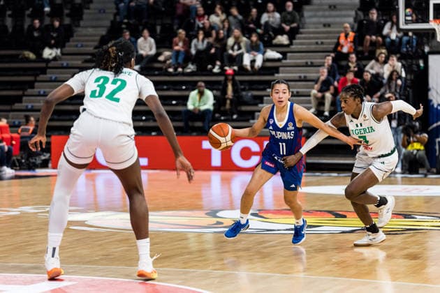 LYON-VILLEURBANNE, FRANCE - MARCH 14: Stefanie Berberabe (Philippines, 11) controls the ball against Sarah Ogoke (Nigeria, 7) during the FIBA Women™s World Cup Qualifying Tournament match between Nigeria (NGR) vs. Philippines (PHI) at Astroballe on matchday 3 of the FIBA Women™s World Cup Qualifying Tournament on March 14, 2026 in Lyon-Villeurbanne, France. France Copyright: xSteffiexWunderlx