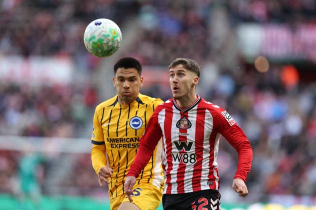 Sunderland, England, 14th March 2026. Trai Hume (R) of Sunderland in action with Diego Gomez of Brighton and Hove Albion during the Sunderland vs Brighton and Hove Albion Premier League match at the Stadium Of Light, Sunderland. Picture credit should read: Nigel Roddis Sportimage EDITORIAL USE ONLY. No use with unauthorised audio, video, data, fixture lists, club league logos or live services. Online in-match use limited to 120 images, no video emulation. No use in betting, games or single club league player publications. SPI_009_NR_SUND_BRIG SPI-4601-0009
