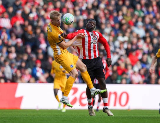 Sunderland, England, 14th March 2026. Brian Brobby (R) of Sunderland in action with Jan Paul Van Hecke of Brighton and Hove Albion during the Sunderland vs Brighton and Hove Albion Premier League match at the Stadium Of Light, Sunderland. Picture credit should read: Nigel Roddis Sportimage EDITORIAL USE ONLY. No use with unauthorised audio, video, data, fixture lists, club league logos or live services. Online in-match use limited to 120 images, no video emulation. No use in betting, games or single club league player publications. SPI_011_NR_SUND_BRIG SPI-4601-0011