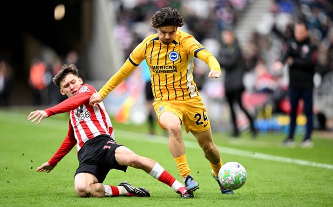Chris Rigg of Sunderland tackles Ferdi Kadioglu of Brighton & Hove Albion Sunderland v Brighton and Hove Albion, Premier League, Football, Stadium of Light, Sunderland, UK - 14 Mar 2026Sunderland Stadium of Light United Kingdom EDITORIAL USE ONLY No use with unauthorised audio, video, data, fixture lists, club league logos or live services. Online in-match use limited to 120 images, no video emulation. No use in betting, games or single club league player publications. Copyright: xGreigxCowie Shutterstockx 16757170as