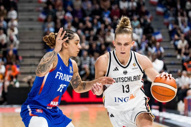 LYON-VILLEURBANNE, FRANCE - MARCH 14: Leonie Fiebich (Germany, 13) controls the ball against Gabby Williams (France, 15) during the FIBA Women™s World Cup Qualifying Tournament match between Germany (GER) vs. France (FRA) at Astroballe on matchday 3 of the FIBA Women™s World Cup Qualifying Tournament on March 14, 2026 in Lyon-Villeurbanne, France. France Copyright: xSteffiexWunderlx