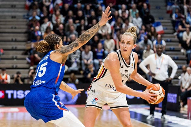 LYON-VILLEURBANNE, FRANCE - MARCH 14: Leonie Fiebich (Germany, 13) controls the ball against Gabby Williams (France, 15) during the FIBA Women™s World Cup Qualifying Tournament match between Germany (GER) vs. France (FRA) at Astroballe on matchday 3 of the FIBA Women™s World Cup Qualifying Tournament on March 14, 2026 in Lyon-Villeurbanne, France. France Copyright: xSteffiexWunderlx