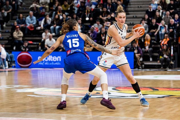 LYON-VILLEURBANNE, FRANCE - MARCH 14: Leonie Fiebich (Germany, 13) controls the ball against Gabby Williams (France, 15) during the FIBA Women™s World Cup Qualifying Tournament match between Germany (GER) vs. France (FRA) at Astroballe on matchday 3 of the FIBA Women™s World Cup Qualifying Tournament on March 14, 2026 in Lyon-Villeurbanne, France. France Copyright: xSteffiexWunderlx