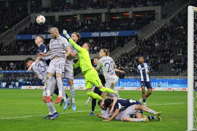 BERLIN, DEUTSCHLAND - MARCH 14: Goal area scene of Hertha, goalkeeper Timo Horn (VfL Bochum, 1) fists the ball, Philipp Hofmann (VfL Bochum, 33) on the header, Kevin Sessa (Hertha, 8) on the ground, during the match in the 2. German Bundesliga: Hertha BSC - VfL Bochum at Olympiastadion on matchday 26 on March 14, 2026 in Berlin, Deutschland. DFB regulations prohibit any use of photographs as image sequences and or quasi video. Berlin Deutschland Copyright: xO.Frankex
