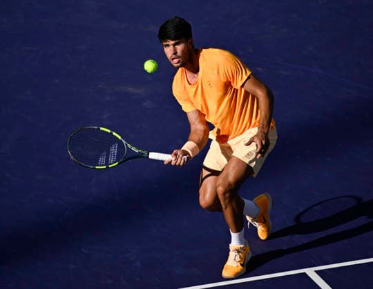 March 14, 2026 Carlos Alcaraz (ESP) returns a shot against Daniil Medvedev during their semifinal match at the BNP Paribas Open held at the Indian Wells Tennis Garden in Indian Wells, California. Mandatory Photo Credit : CSM Indian Wells United States of America - ZUMAc04_ 20260314_zma_c04_064 Copyright: xCharlesxBausx