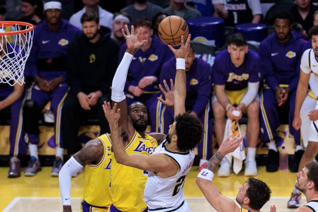 March 14, 2026, Los Angeles, California, USA: Jamal Murray 27 of the Denver Nuggets shoots a floater as Deandre Ayton 5 of the Los Angeles Lakers defends the basket during their regular season NBA, Basketball Herren, USA game on Saturday March 14, 2026 at Crypto.com Arena in Los Angeles, California. ARIANA RUIZ PI Los Angeles USA - ZUMAp124 20260314_zaa_p124_024 Copyright: xArianaxRuizx