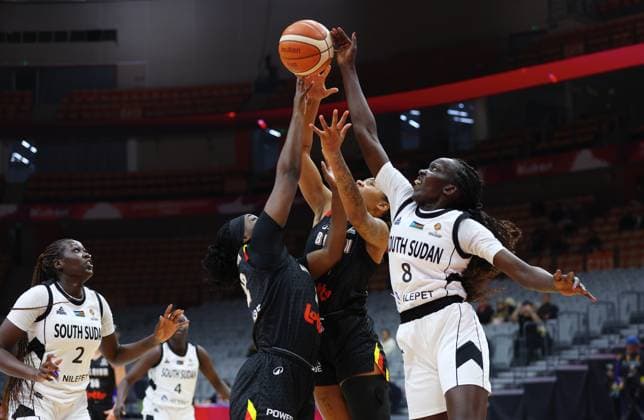 Belgium s Bethy Mununga, Belgium s Maxuella Lisowa Mbaka and South Sudan s Rose Macuei fight for the ball during a basket game between Belgium s national team, Nationalteam Belgian Cats and South Sudan, in Wuhan, China, on Sunday 15 March 2026, the fourth game (out of 5) of the qualifications phase for the World Cup Basket tournament. NIKOLAxKRSTIC  x167535242x