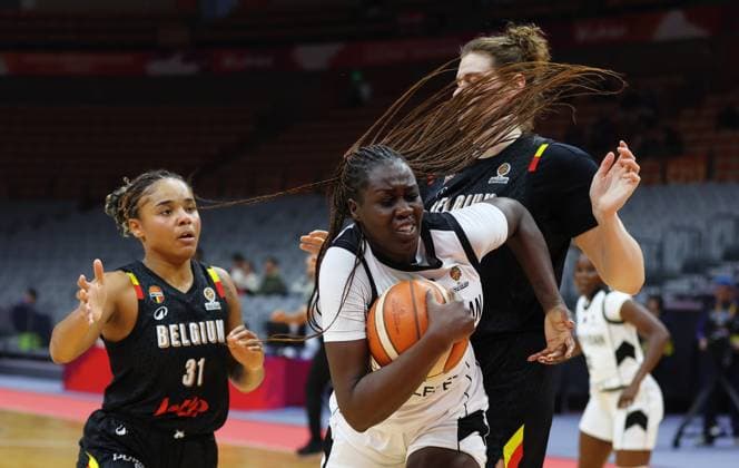 South Sudan s Adut Bulgak and Belgium s Kyara Linskens fight for the ball during a basket game between Belgium s national team, Nationalteam Belgian Cats and South Sudan, in Wuhan, China, on Sunday 15 March 2026, the fourth game (out of 5) of the qualifications phase for the World Cup Basket tournament. NIKOLAxKRSTIC  x167535703x