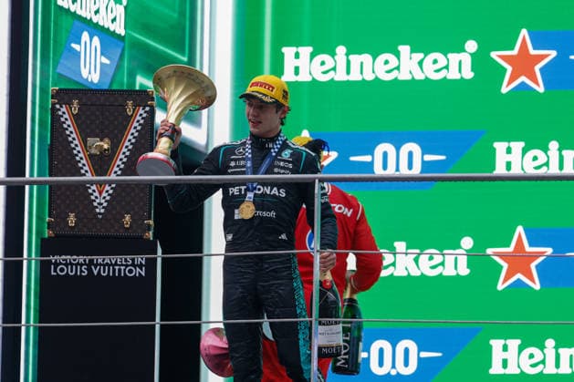 CHINA-MOTORSPORTS F1-SHANGHAI Mercedes™ Kimi Antonelli holding up his trophy on stage after winning at Shanghai International Circuit at the F1 Chinese Grand Prix, Shanghai, China, March 15, 2026. NEXPHER Peter Li SHANGHAI