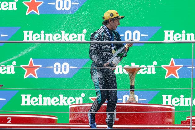 CHINA-MOTORSPORTS F1-SHANGHAI Mercedes™ Kimi Antonelli spraying champaign on the podium after coming in top 3 at Shanghai International Circuit at the F1 Chinese Grand Prix, Shanghai, China, March 15, 2026. NEXPHER Peter Li SHANGHAI