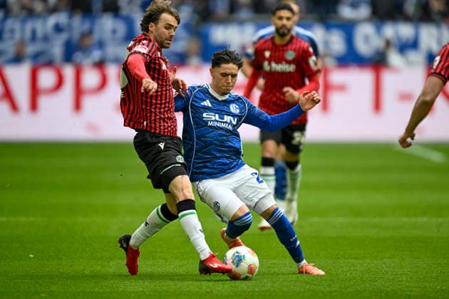 v. li. im Zweikampf Kolja Oudenne (Hannover 29) Kevin Müller Mueller (Schalke 22) 15.03.2026 ¢ Fussball ¢ FC Schalke 04 vs Hannover 96, Veltins-Arena, Gelsenkirchen, DFB DFL REGULATIONS PROHIBIT ANY USE OF PHOTOGRAPHS AS IMAGE SEQUENCES AND OR QUASI-VIDEO