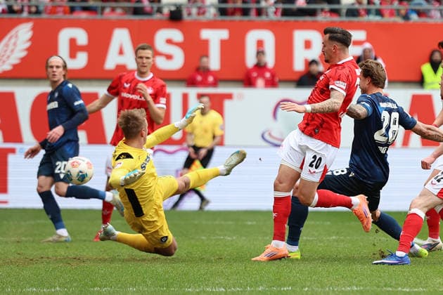 15.03.2026, xrekx, Fussball 2.Bundesliga, 1.FC Kaiserslautern - Karlsruher SC v.l. Torschuss zum 2:0 durch Mergim Berisha (1.FC Kaiserslautern) Hans Christian Bernat (Karlsruher SC) (DFL DFB REGULATIONS PROHIBIT ANY USE OF PHOTOGRAPHS as IMAGE SEQUENCES and or QUASI-VIDEO) Kaiserslautern