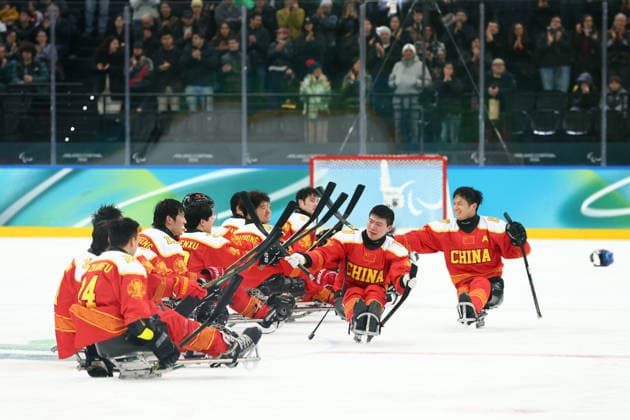 March 15, 2026, Milan, Lombardy, Italy: TEAM CHINA PLAYERS of whom captain WANG ZHIDONG celebrate winning the Bronze Medal Game against Team Czechia (CZE) at the Milano Cortina 2026 Paralympic Winter games, Winterspiele,Spiele, Summer games China won 3:2. Paralympics 2026: Milano Cortina: Para Ice hockey, Eishockey Men s Bronze Medal Game: CZE 2:3 CHN  - ZUMAc179 20260315_oly_c179_005 Copyright: xMickaelxChavetx