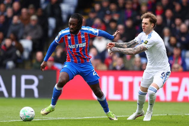London, England, 15th March 2026. Evann Guessand of Crystal Palace and Joe Rodon of Leeds United challenge for the ball during the Crystal Palace vs Leeds United Premier League match at Selhurst Park, London. Picture credit should read: Paul Terry Sportimage EDITORIAL USE ONLY. No use with unauthorised audio, video, data, fixture lists, club league logos or live services. Online in-match use limited to 120 images, no video emulation. No use in betting, games or single club league player publications. SPI_014_PT_Crystal_Palace_Leeds SPI-4603-0014