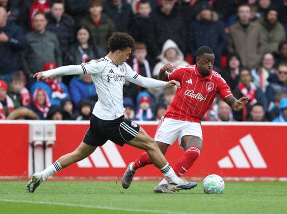 Nottingham, England, 15th March 2026. Antonee Robinson of Fulham tackles Callum Hudson-Odoi of Nottingham Forest (r) during the Nottingham Forest vs Fulham Premier League match at the City Ground, Nottingham. Picture credit should read: Gareth Evans Sportimage EDITORIAL USE ONLY. No use with unauthorised audio, video, data, fixture lists, club league logos or live services. Online in-match use limited to 120 images, no video emulation. No use in betting, games or single club league player publications. SPI_019_GE_NFFC_vs_FFC SPI-4604-0019