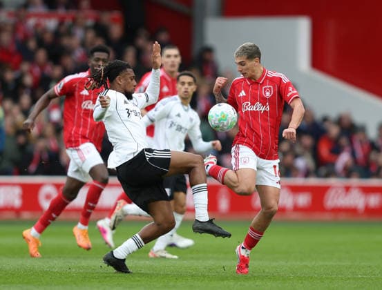Nottingham, England, 15th March 2026. Alex Iwobi of Fulham and Nicolas Dominguez of Nottingham Forest during the Nottingham Forest vs Fulham Premier League match at the City Ground, Nottingham. Picture credit should read: Gareth Evans Sportimage EDITORIAL USE ONLY. No use with unauthorised audio, video, data, fixture lists, club league logos or live services. Online in-match use limited to 120 images, no video emulation. No use in betting, games or single club league player publications. SPI_020_GE_NFFC_vs_FFC SPI-4604-0020
