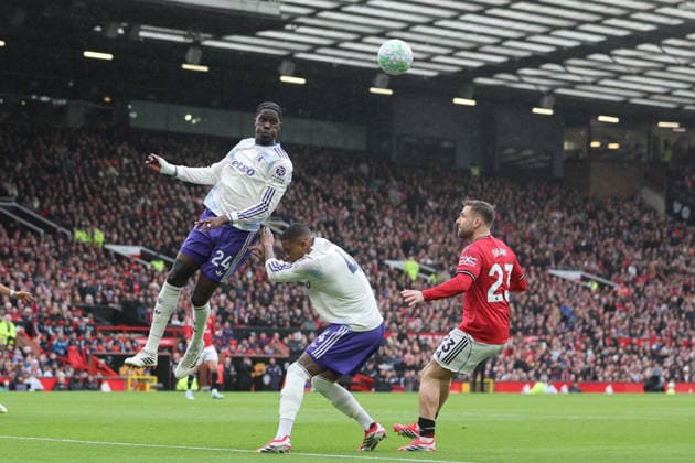 15th March 2026; Old Trafford, Manchester, England; Premier League Football, Manchester United, ManU versus Aston Villa; Amadou Onana of Aston Villa clears watched by Luke Shaw of Manchester United  RogerxEvans Content restricted for UK based newspaper