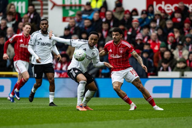 15th March 2026; The City Ground, Nottingham, England; Premier League Football, Nottingham Forest versus Fulham; Morgan Gibbs-White of Nottingham Forest challenges Kenny Tete of Fulham FC for the ball  GodfreyxPitt Content restricted for UK based newspaper