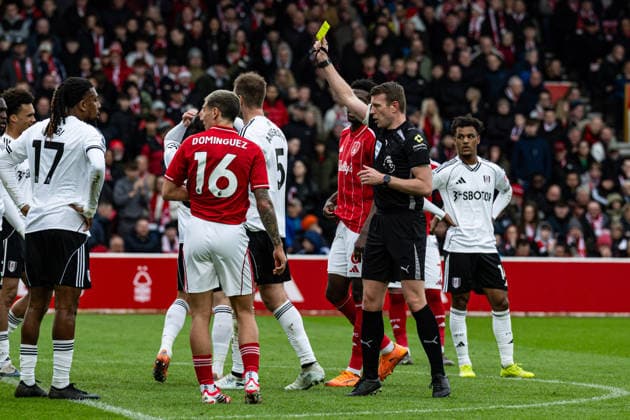 15th March 2026; The City Ground, Nottingham, England; Premier League Football, Nottingham Forest versus Fulham; Referee Sam Barrott issues a yellow card to Sander Berge of Fulham FC  GodfreyxPitt Content restricted for UK based newspaper