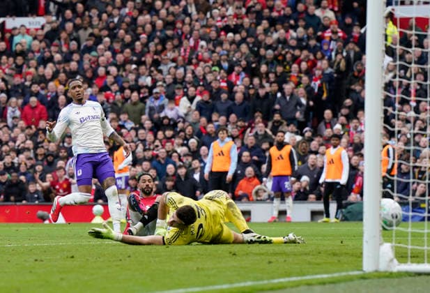 Manchester, England, 15th March 2026. Matheus Cunha of Manchester United, ManU scoring their second goal during the Manchester United vs Aston Villa Premier League match at Old Trafford, Manchester. Picture credit should read: Andrew Yates Sportimage EDITORIAL USE ONLY. No use with unauthorised audio, video, data, fixture lists, club league logos or live services. Online in-match use limited to 120 images, no video emulation. No use in betting, games or single club league player publications. SPI_064_AY_Man_Utd_Villa SPI-4605-0064