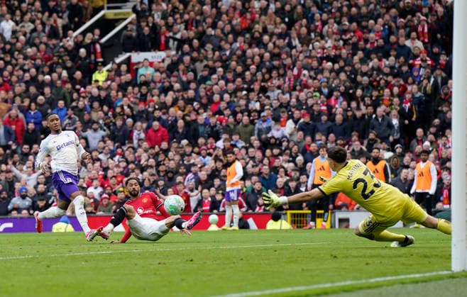 Manchester, England, 15th March 2026. Matheus Cunha of Manchester United, ManU scoring their second goal during the Manchester United vs Aston Villa Premier League match at Old Trafford, Manchester. Picture credit should read: Andrew Yates Sportimage EDITORIAL USE ONLY. No use with unauthorised audio, video, data, fixture lists, club league logos or live services. Online in-match use limited to 120 images, no video emulation. No use in betting, games or single club league player publications. SPI_067_AY_Man_Utd_Villa SPI-4605-0067