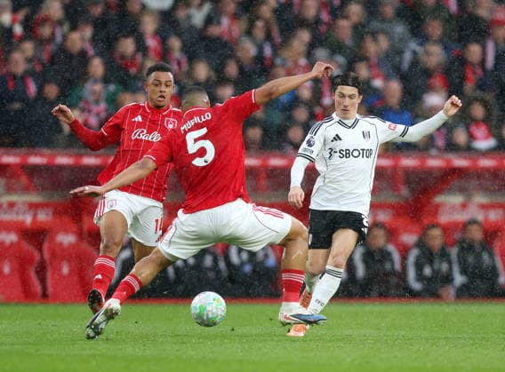 Nottingham, England, 15th March 2026. Harry Wilson of Fulham threads theball past Murillo of Nottingham Forest during the Nottingham Forest vs Fulham Premier League match at the City Ground, Nottingham. Picture credit should read: Gareth Evans Sportimage EDITORIAL USE ONLY. No use with unauthorised audio, video, data, fixture lists, club league logos or live services. Online in-match use limited to 120 images, no video emulation. No use in betting, games or single club league player publications. SPI_026_GE_NFFC_vs_FFC SPI-4604-0026