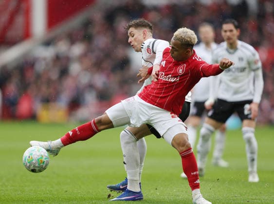 Nottingham, England, 15th March 2026. Tom Cairney of Fulham tackles Omari Hutchinson of Nottingham Forest during the Nottingham Forest vs Fulham Premier League match at the City Ground, Nottingham. Picture credit should read: Gareth Evans Sportimage EDITORIAL USE ONLY. No use with unauthorised audio, video, data, fixture lists, club league logos or live services. Online in-match use limited to 120 images, no video emulation. No use in betting, games or single club league player publications. SPI_029_GE_NFFC_vs_FFC SPI-4604-0029